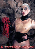 Domina with transparent facemask in the dungeon
